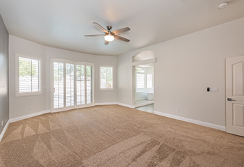 Newly installed drywall and hardwood flooring in a remodeled Calabasas living room – bright, modern design with natural finishes.
